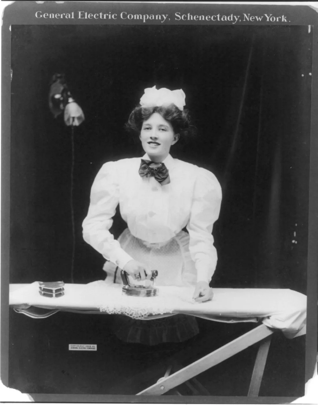 GE electric iron in use, 1908